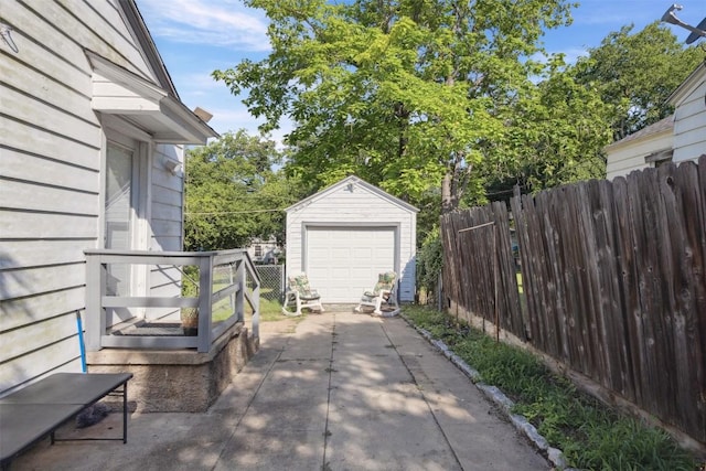 1514 S 13th St, Temple, TX 76504 - view of patio with concrete driveway, an outdoor structure, and a garage