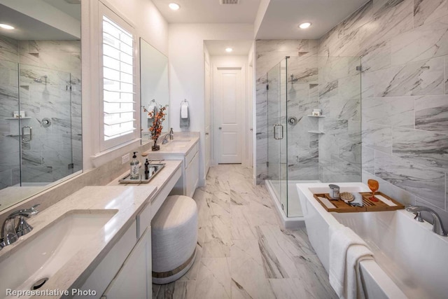 bathroom featuring vanity and shower with separate bathtub