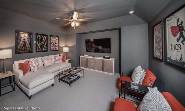 carpeted living room featuring ceiling fan and lofted ceiling