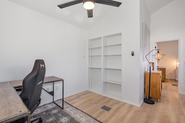 office area featuring lofted ceiling, ceiling fan, and light wood-type flooring