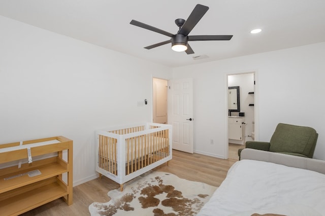 bedroom with light hardwood / wood-style flooring and ceiling fan