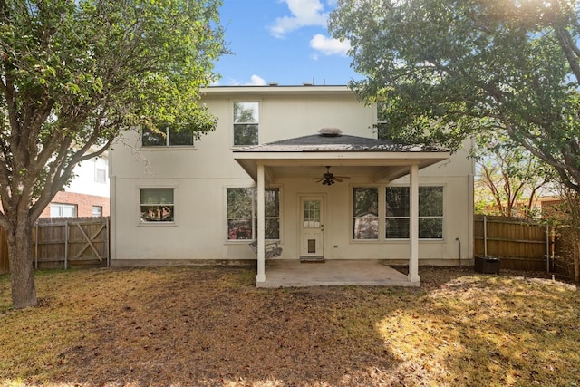 back of property with a patio area and ceiling fan