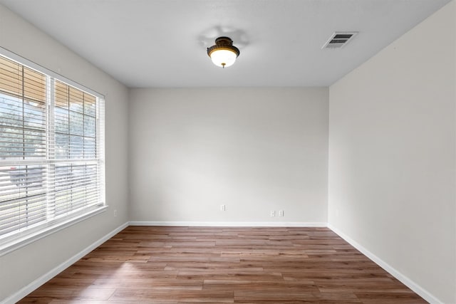 unfurnished room featuring wood-type flooring