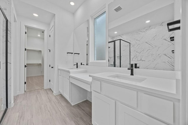 bathroom with vanity and walk in shower