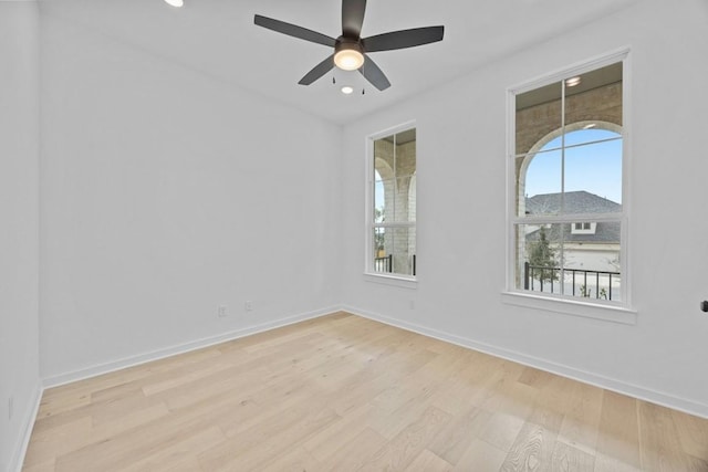 unfurnished room with ceiling fan and light hardwood / wood-style floors