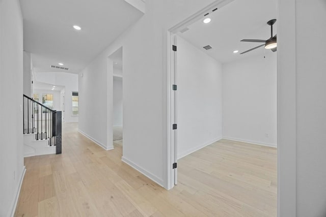 interior space featuring light hardwood / wood-style floors and ceiling fan