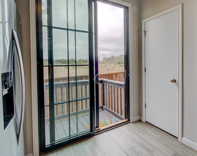 entryway with light hardwood / wood-style flooring