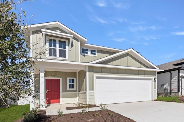 160 Lavender Ln, Elgin, TX 78621 - view of front facade featuring board and batten siding, driveway, and an attached garage