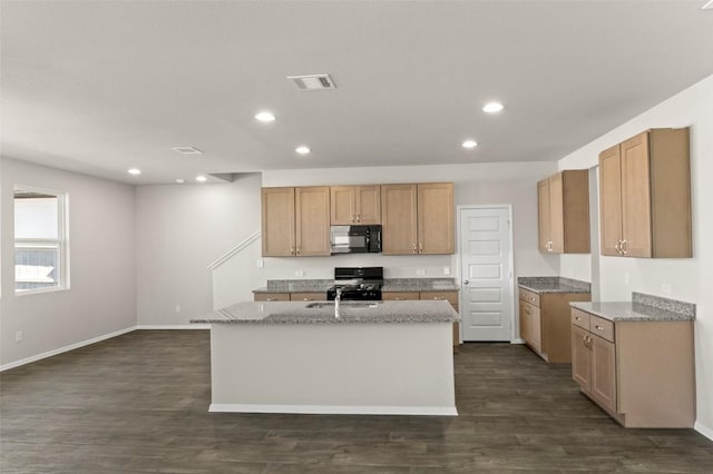 160 Lavender Ln, Elgin, TX 78621 - kitchen featuring black appliances, recessed lighting, a center island with sink, dark wood-style floors, and baseboards