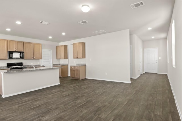 160 Lavender Ln, Elgin, TX 78621 - kitchen featuring black microwave, range, recessed lighting, dark wood-type flooring, and baseboards