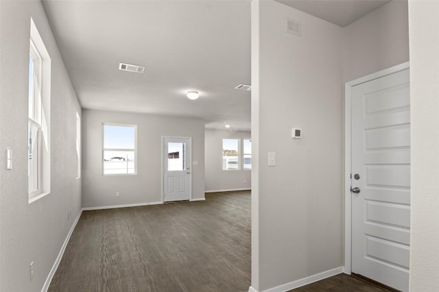 160 Lavender Ln, Elgin, TX 78621 - foyer entrance with dark wood-style flooring and baseboards