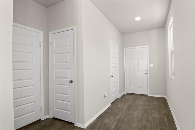 160 Lavender Ln, Elgin, TX 78621 - hall featuring dark wood finished floors, baseboards, and recessed lighting