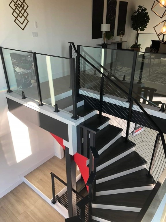 stairs featuring hardwood / wood-style flooring