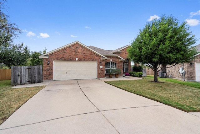 single story home with central air condition unit, a front yard, and a garage