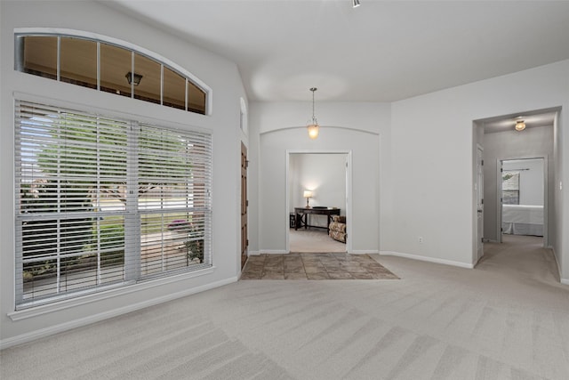 view of carpeted entrance foyer