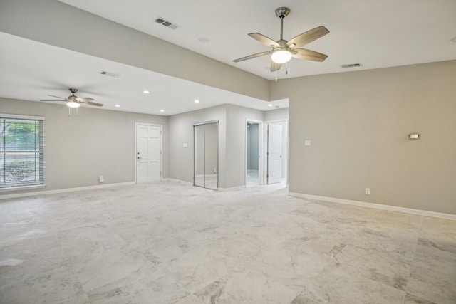 unfurnished room with ceiling fan