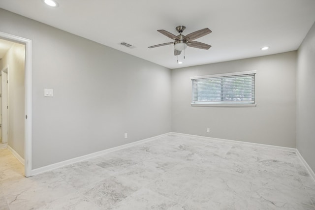 spare room with ceiling fan