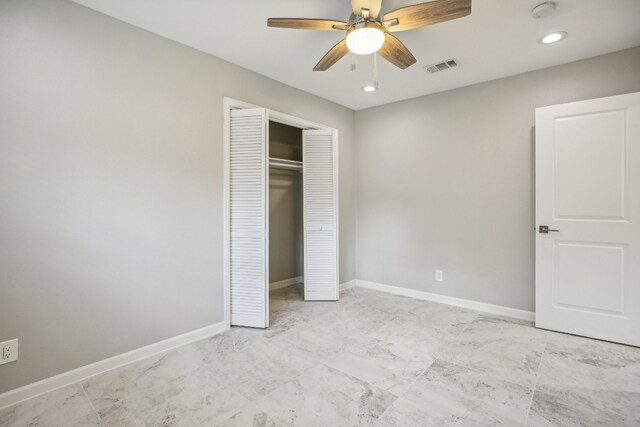 unfurnished bedroom featuring a closet and ceiling fan