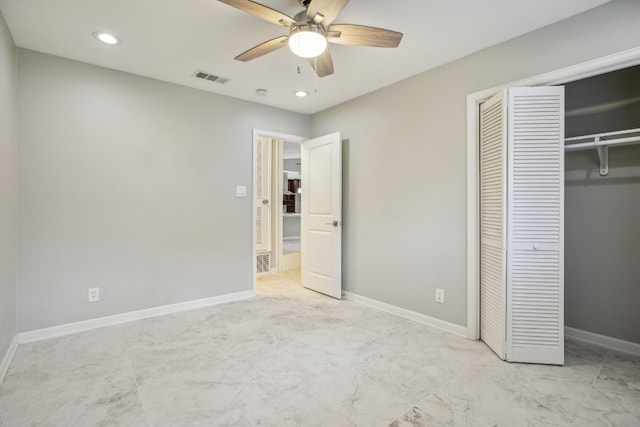 unfurnished bedroom with ceiling fan and a closet