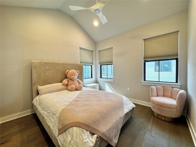 bedroom with vaulted ceiling, ceiling fan, and dark hardwood / wood-style flooring