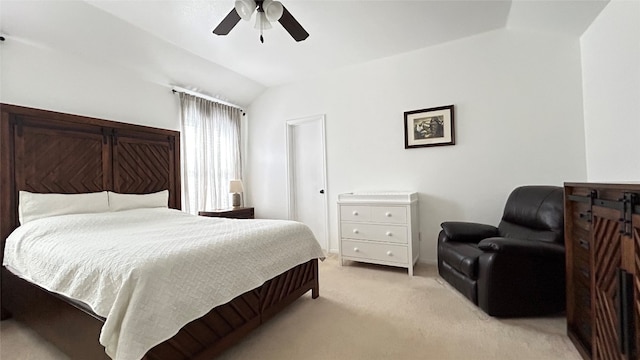 carpeted bedroom featuring lofted ceiling and ceiling fan