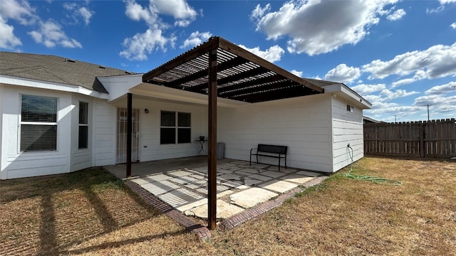 rear view of property with a patio, a lawn, and a pergola