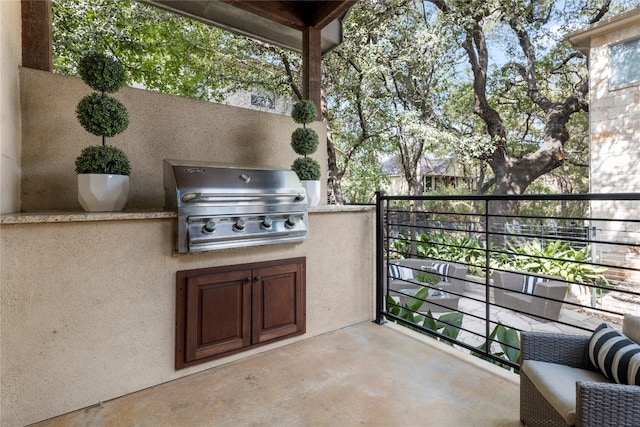 view of patio with grilling area, area for grilling, and a balcony