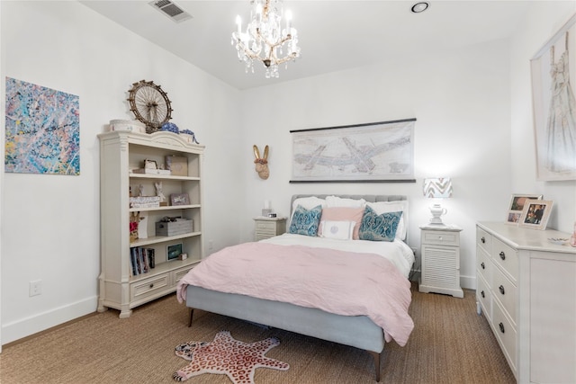 bedroom featuring an inviting chandelier and light colored carpet