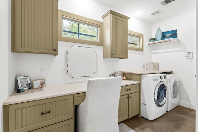 laundry area featuring cabinets and washer and clothes dryer