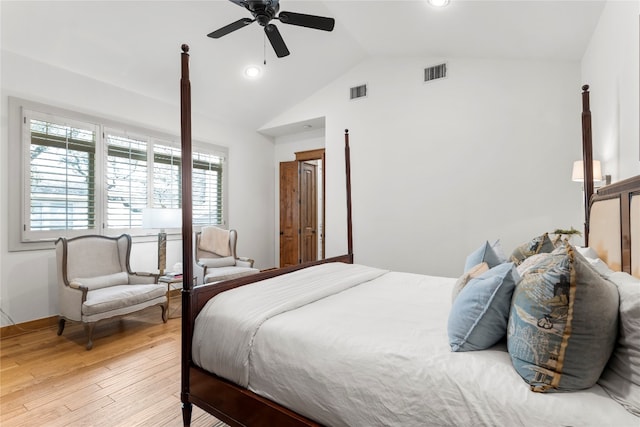 bedroom with vaulted ceiling, ceiling fan, and light hardwood / wood-style flooring