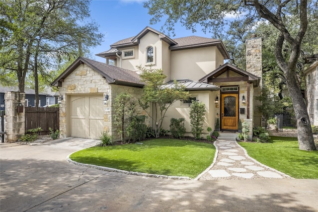 view of front facade with a garage and a front lawn