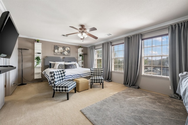 bedroom with carpet flooring, ceiling fan, and ornamental molding