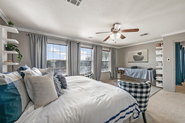 bedroom featuring ceiling fan, ornamental molding, a textured ceiling, and light carpet