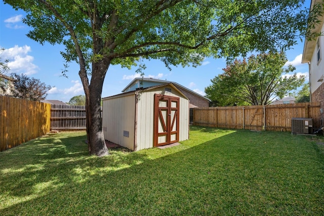 view of outdoor structure featuring a yard and cooling unit