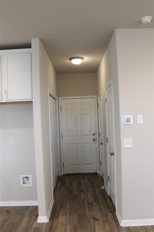 hallway with dark wood-type flooring