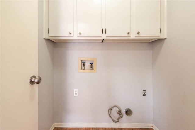 washroom with washer hookup, cabinets, hookup for a gas dryer, and electric dryer hookup