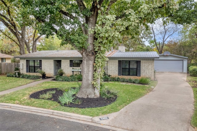 ranch-style house featuring a garage and a front lawn