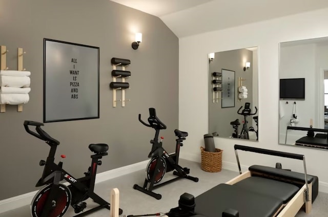 workout room featuring vaulted ceiling