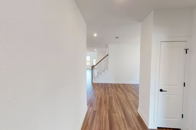 hallway featuring light hardwood / wood-style flooring