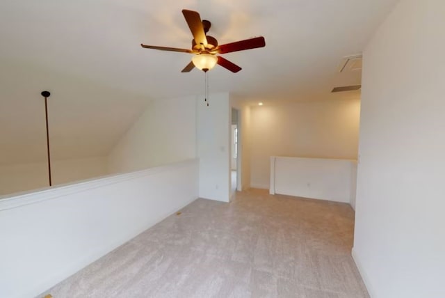 bonus room with lofted ceiling, light colored carpet, and ceiling fan