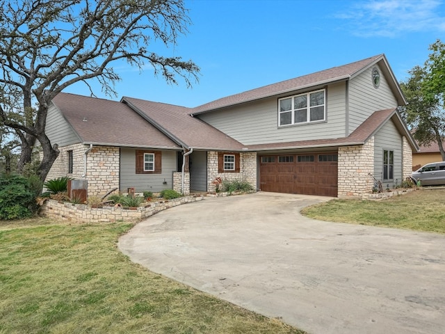 view of front of property with a garage and a front yard