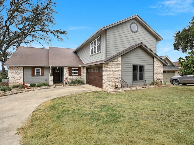 front facade with a front lawn and a garage