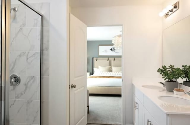 bathroom with vanity and a shower with shower door