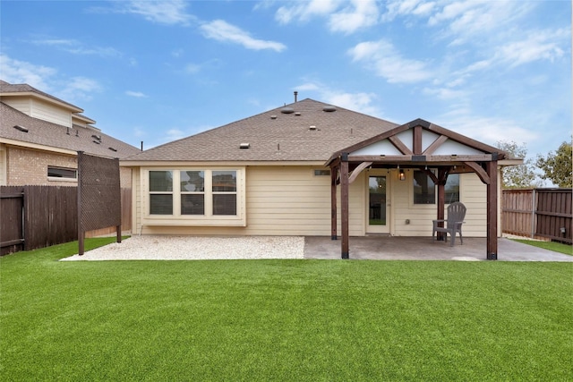 rear view of house with a yard, a patio, and a gazebo