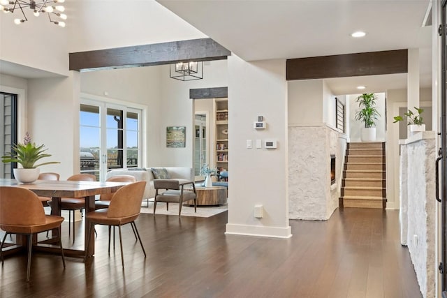 interior space with stairway, baseboards, dark wood-style floors, a notable chandelier, and recessed lighting