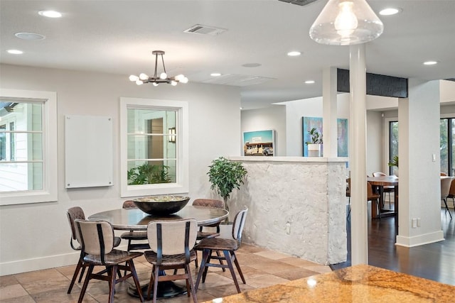 dining space with recessed lighting, baseboards, visible vents, and a notable chandelier