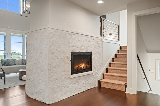 living room featuring dark hardwood / wood-style floors and a high end fireplace