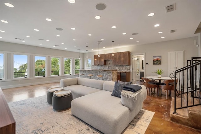 living room with visible vents, recessed lighting, and stairs