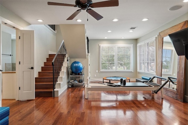 exercise room with ceiling fan, recessed lighting, wood finished floors, and visible vents
