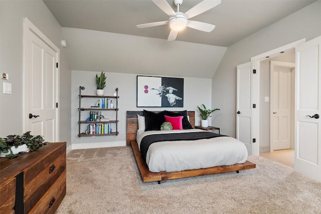 bedroom featuring baseboards, ceiling fan, carpet, and vaulted ceiling